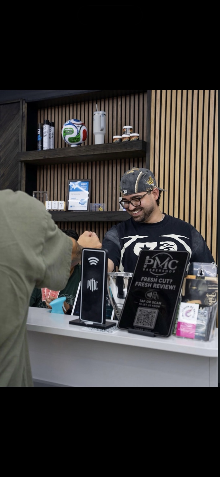 Custom PMC Barbershop review display and Wi-Fi display on a barbershop counter